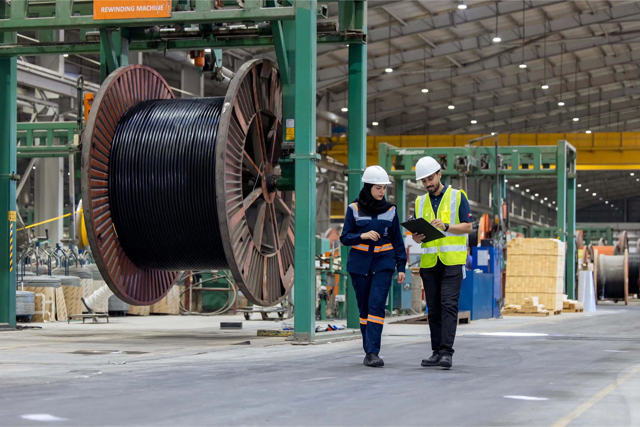 Ducab team discussing quality approvals in the factory