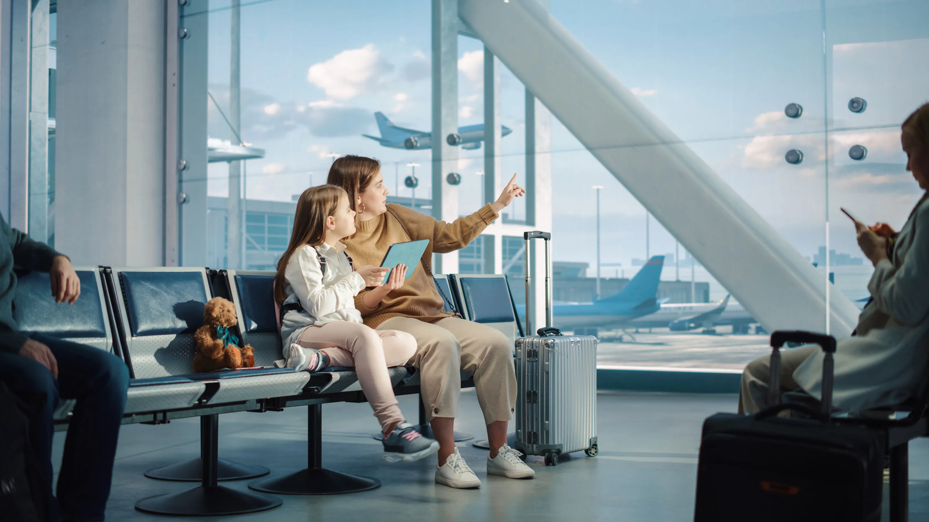 Family at airport representing community infrastructure powered by Ducab